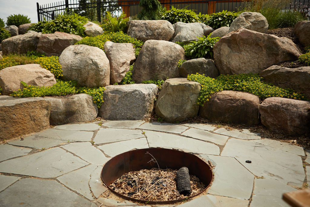Firepit Boulder walls plants